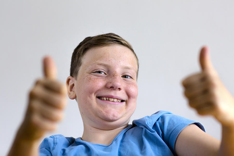 Boy with thumbs up Photograph by Gombert, Sigrid/science Photo Library
