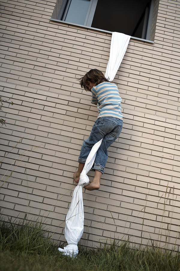 Boys Climbs Out Of Window Using Sheet Rope Photograph by Photo and Co