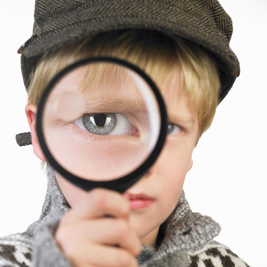 Boy\s eye through a magnifying glass Photograph by Ghislain & Marie David de Lossy