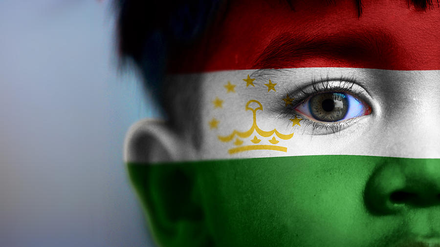 Boys face with digitally placed Tajikistan flag on his face. Photograph by @ Mariano Sayno / husayno.com