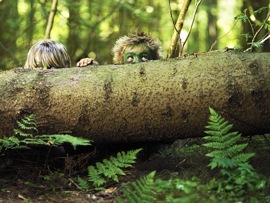 Boys hiding in the forest. Photograph by David Trood