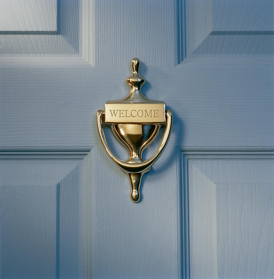 Brass door knocker on front door engraved with word welcome, close-up Photograph by GK Hart/Vikki Hart