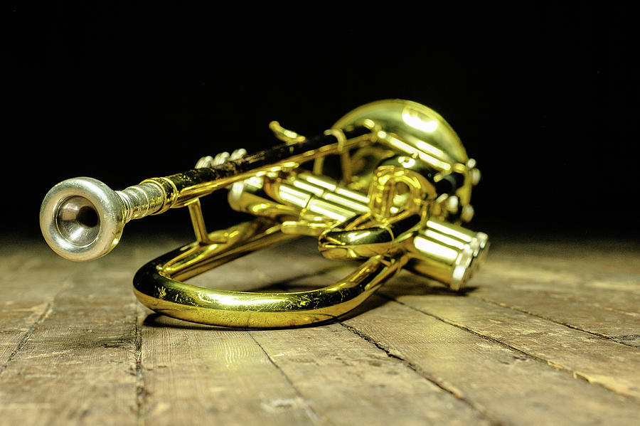 Brass instrument - yellow trumpet on stage with backlight Photograph by ...