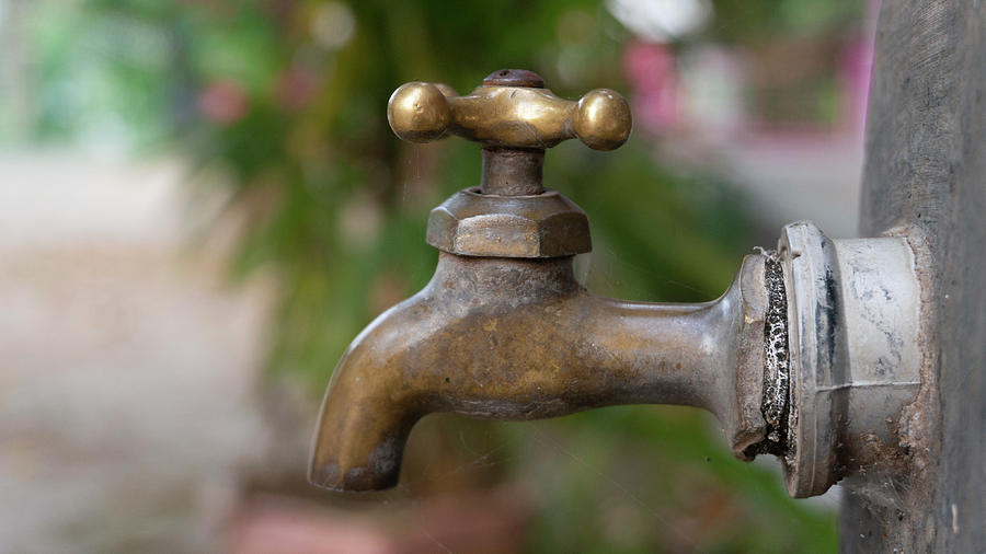 Brass water tap in a school. washing your hands with soap regularly can ...