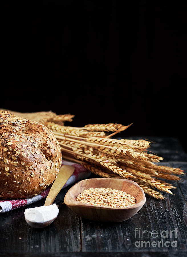 Bread and wheat on black Photograph by Jelena Jovanovic