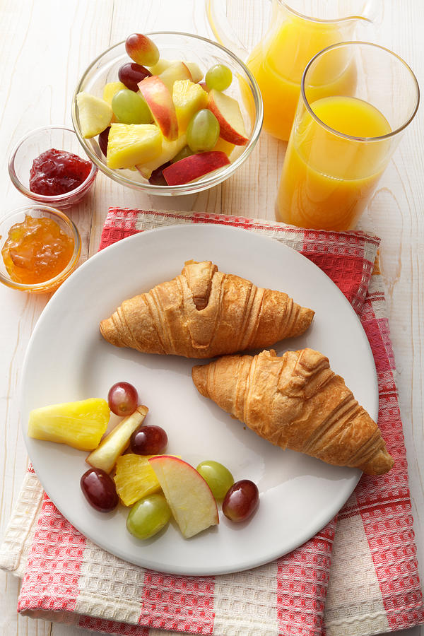 Breakfast: Croissant, Fruit Salad and Orange Juice Still Life Photograph by Floortje