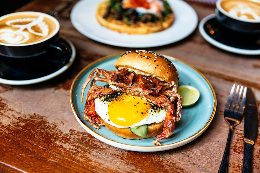 Breakfast in a cafe with crab burger and sunny side up egg Photograph by Alexander Spatari