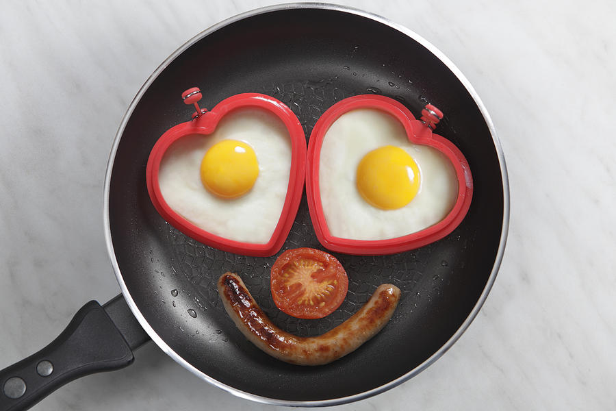 Breakfast With Heart Shapped Eggs In Pan Photograph by Peter Cade