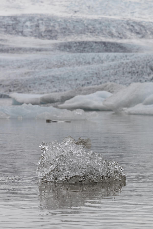 Breaking off Ice at Glacier in Iceland  Photograph by John McGraw