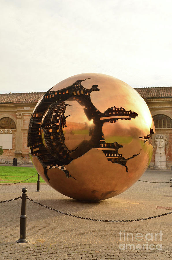 Breathtaking statue of a large sphere with carvings in it  Photograph by DejaVu Designs
