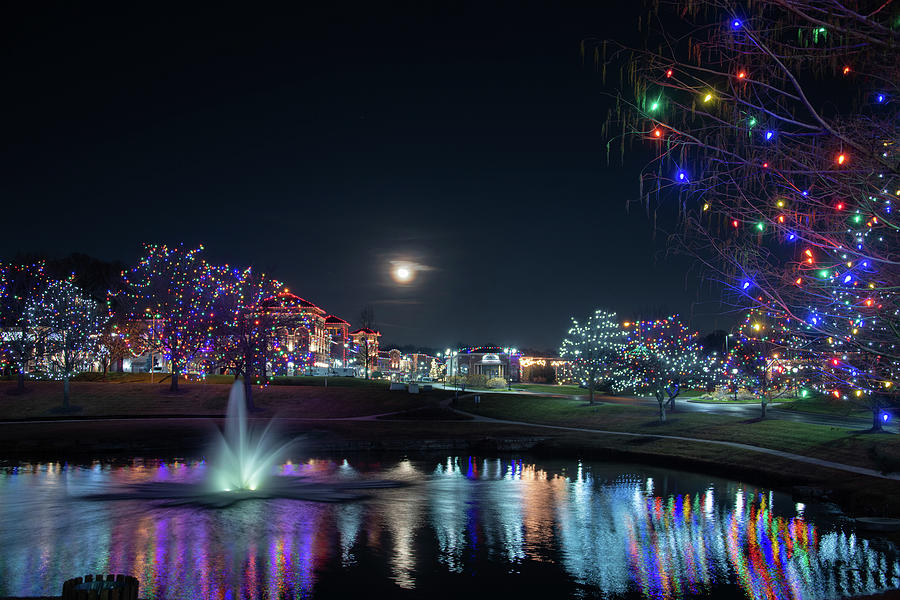 Briarcliff Christmas lights with Moon Photograph by Carol Schultz