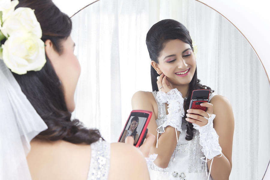 Bride admiring her own photograph Photograph by Sudipta Halder