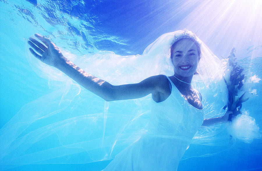 Bride Underwater Smiling, Portrait Photograph by Romilly Lockyer