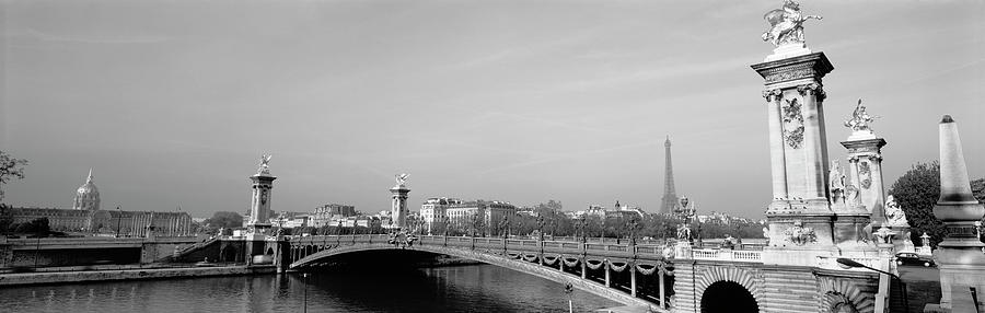 Bridge over a river, Alexandre III Bridge, Eiffel Tower, Paris, France Photograph by Panoramic Images