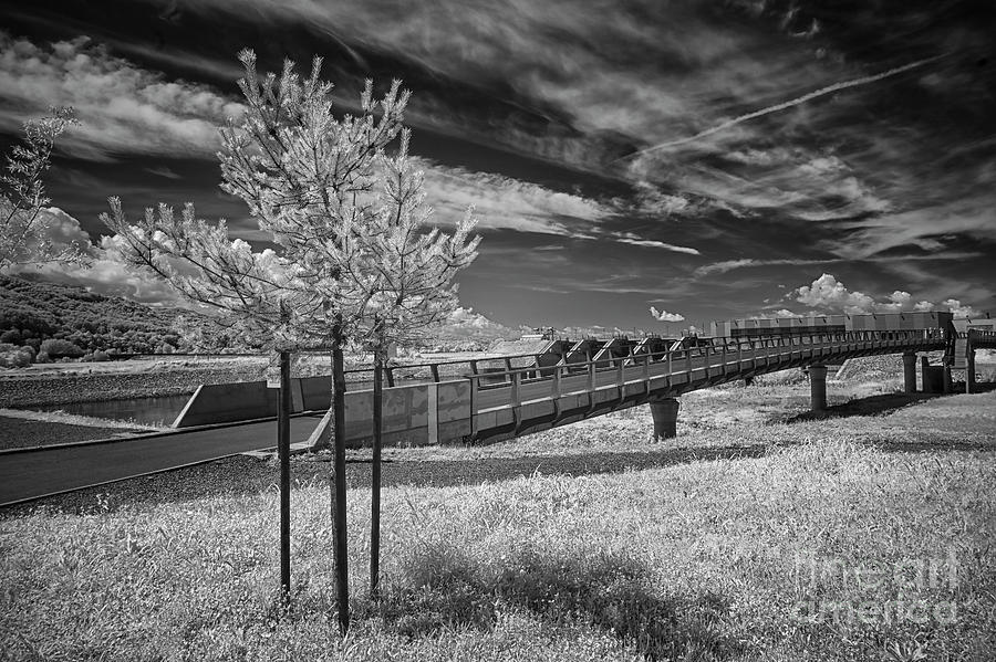 Bridge to the Dam Photograph by Norman Gabitzsch