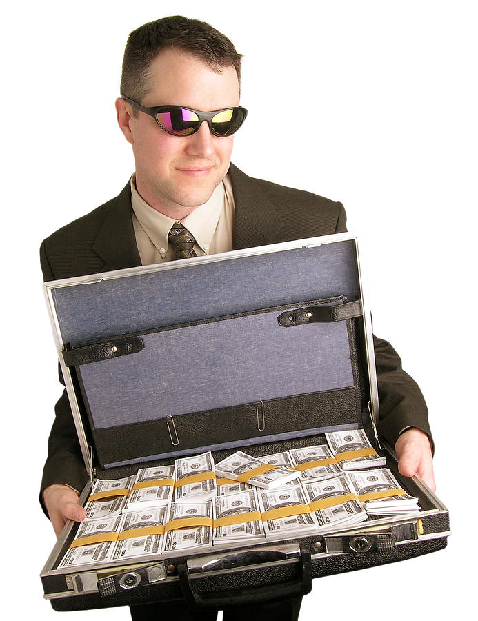 Briefcase full of money Photograph by Kickstand