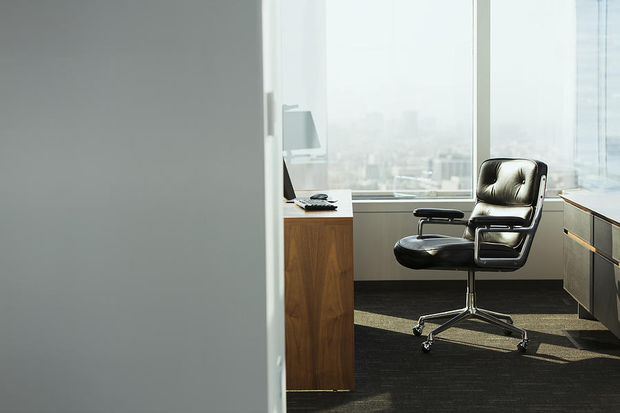 Bright Corner Office Space With Desk And Chairs Photograph by Erik Von Weber