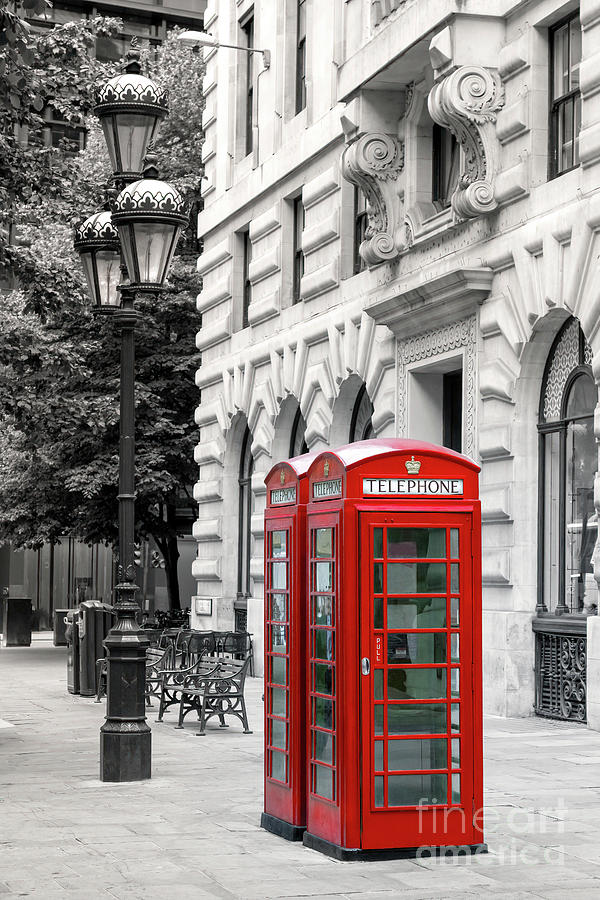 Bright red London phone boxes on a city street with lamp post, b Photograph by Jane Rix