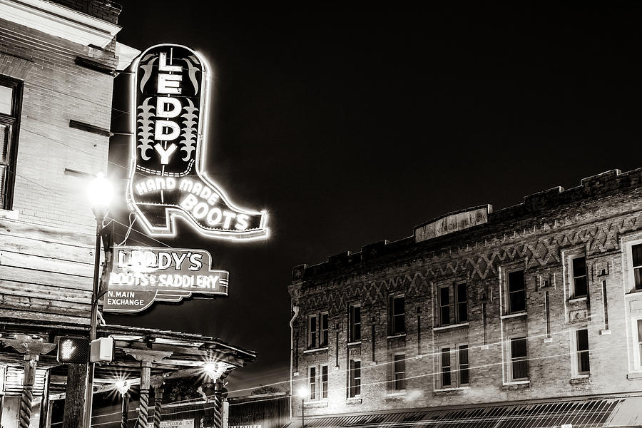 Bright Steps In The Fort Worth Stockyards - Cowboy Boots Neon Light In Classic Sepia Photograph by Gregory Ballos