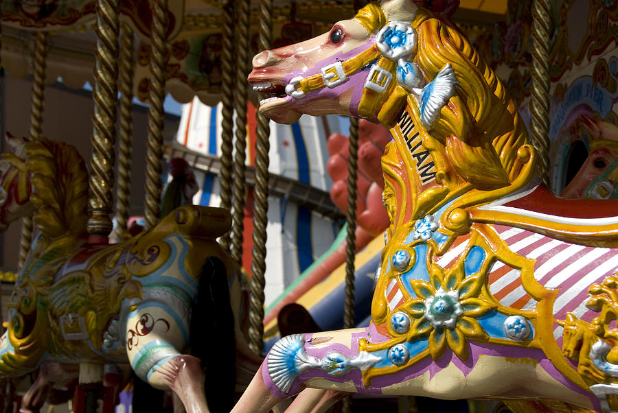 Brightly painted carousel horses Photograph by Lyn Holly Coorg