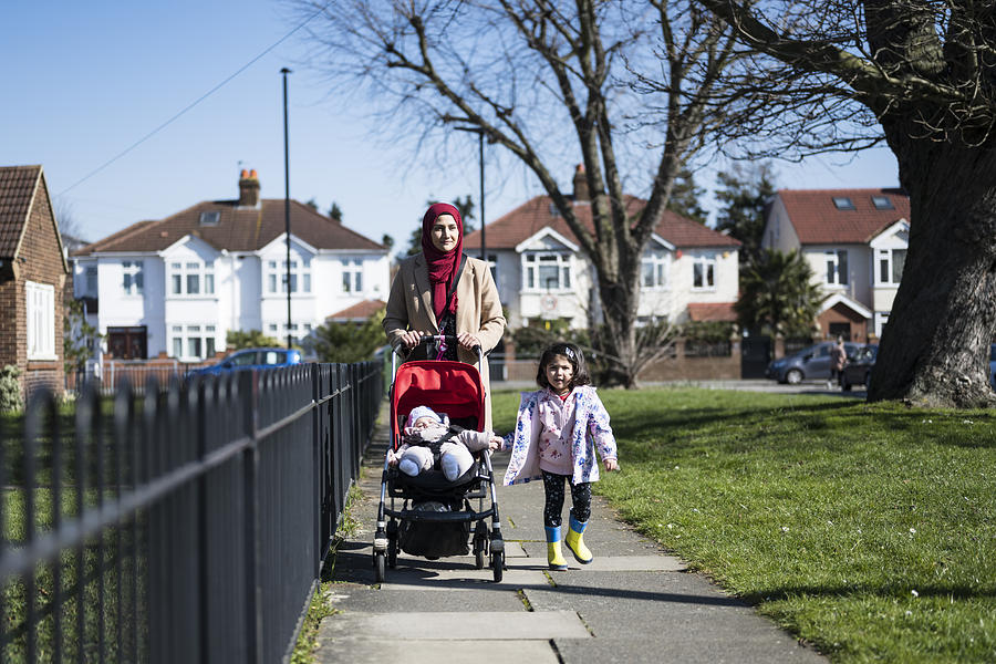 British Asian mother and young children enjoying exercise Photograph by JohnnyGreig