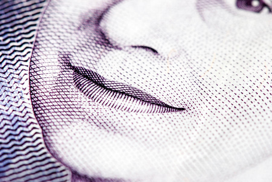 British currency closeup with Queen Elizabeth the second smile detail Photograph by Ilbusca