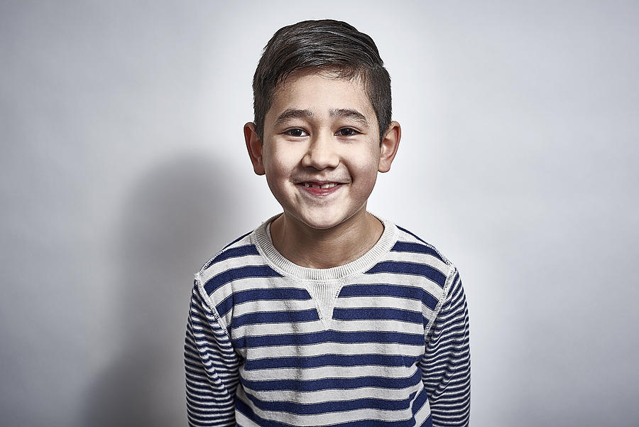 British mixed race child laughing Photograph by Jamie Garbutt