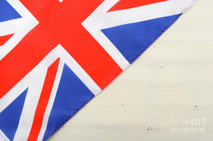British Union Jack Flag on White Wood Background Photograph by Milleflore Images