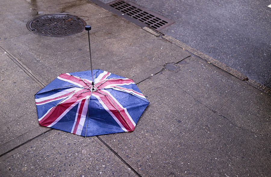 Broken English flag umbrella on ground Photograph by Ballyscanlon