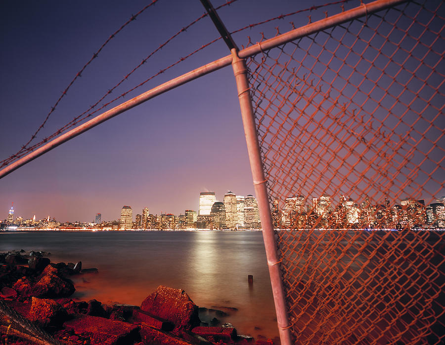 Broken fence at the Hudson river, New York. Photograph by EschCollection