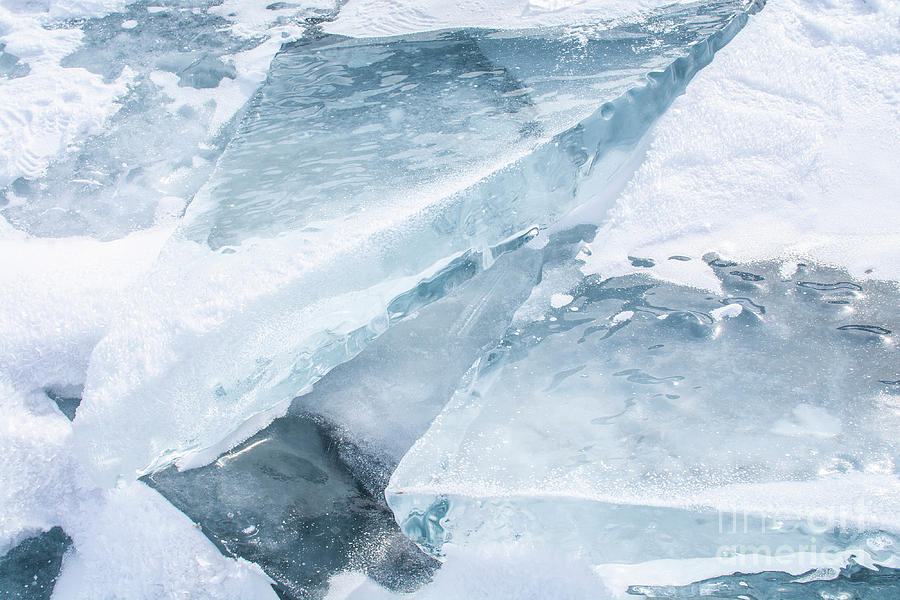 Broken ice in frozen lake Photograph by Nithid Sanbundit - Fine Art America