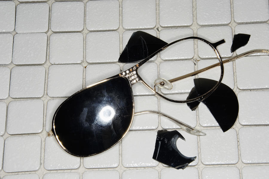 Broken sunglasses on tile Photograph by Ali Smith
