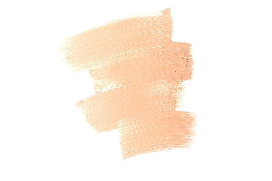 Bronze makeup smear isolated on white background. Liquid foundation makeup texture. Foundation strokes or liquid powder on a white background. Photograph by Yulia Naumenko