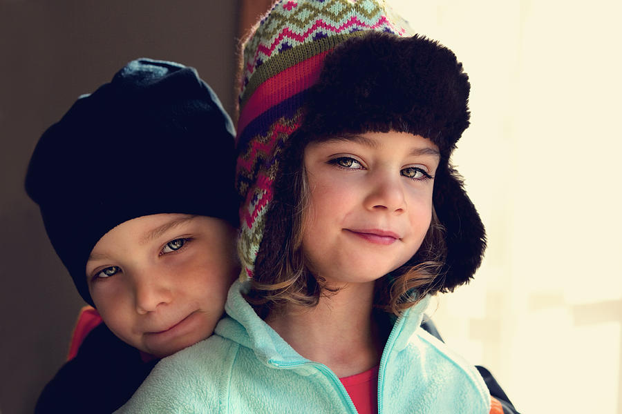 Brother and sister twins in winter hats Photograph by Rebecca Nelson