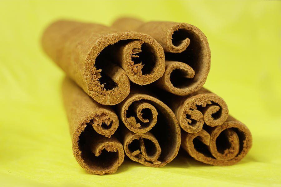 Brown Cinnamon Sticks On Yellow Photograph
