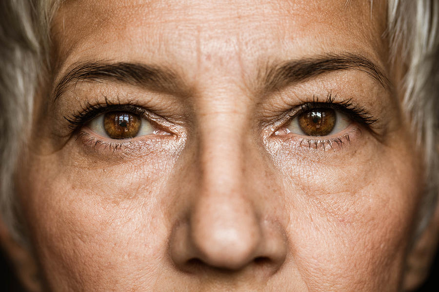 Brown-eyed senior woman. Photograph by Skynesher