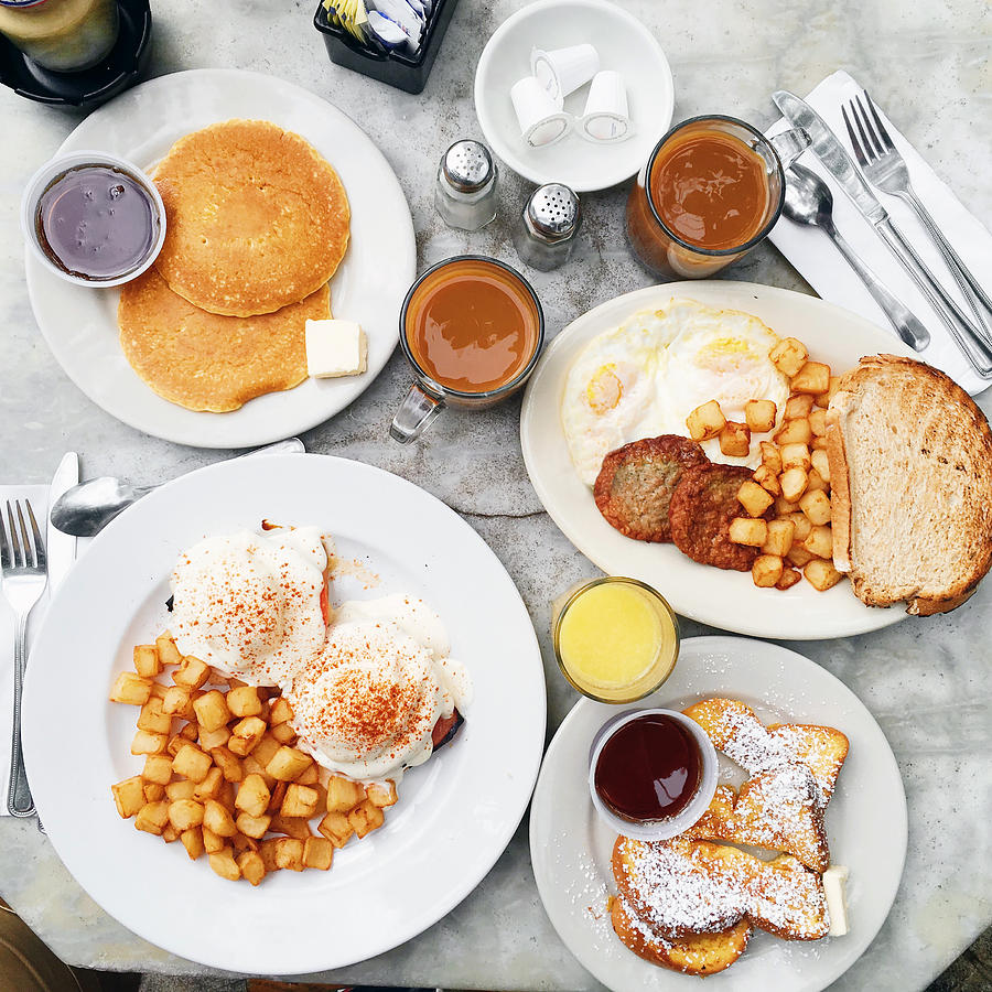 Brunch with eggs Benedict, pancakes, french toast, potato, coffee and juice Photograph by Alexander Spatari