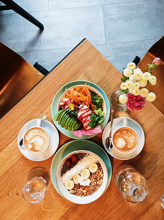 Brunch with quinoa bowl, acai bowl and coffee, high angle view Photograph by Alexander Spatari