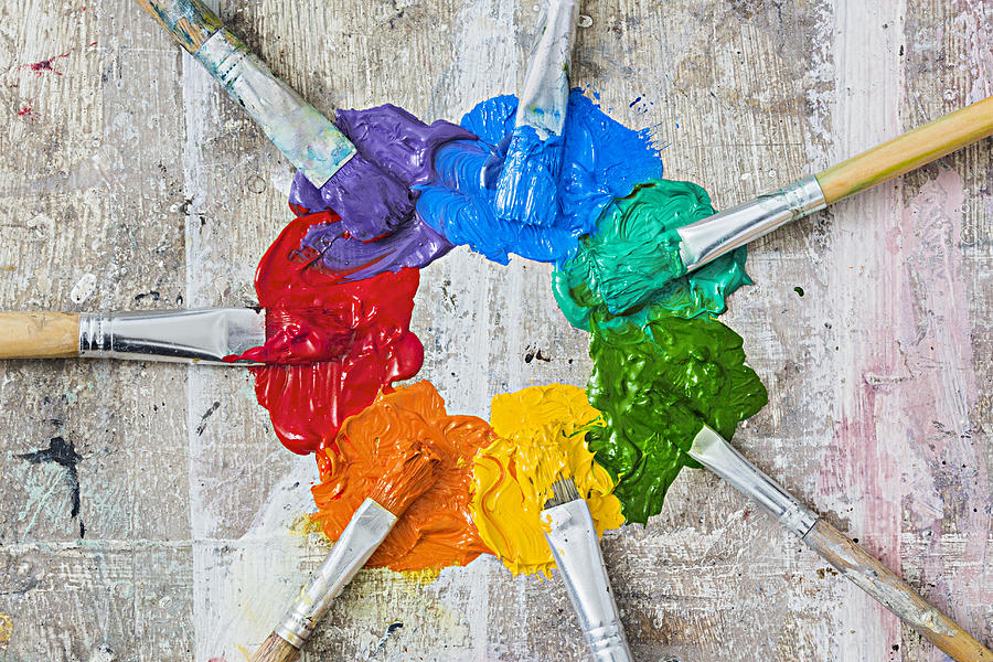 Brushes and oil paint forming a messy colour wheel Photograph by Dimitri Otis