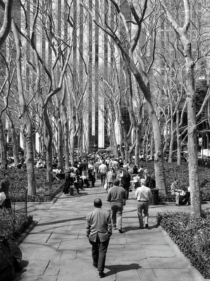 Black And White Photograph - Bryant Park Stroll by Matthew Adelman