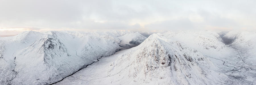 Buachaille Etive Mor Stob Dearg mountain covered in snow aerial Glencoe Scotland Photograph by Sonny Ryse
