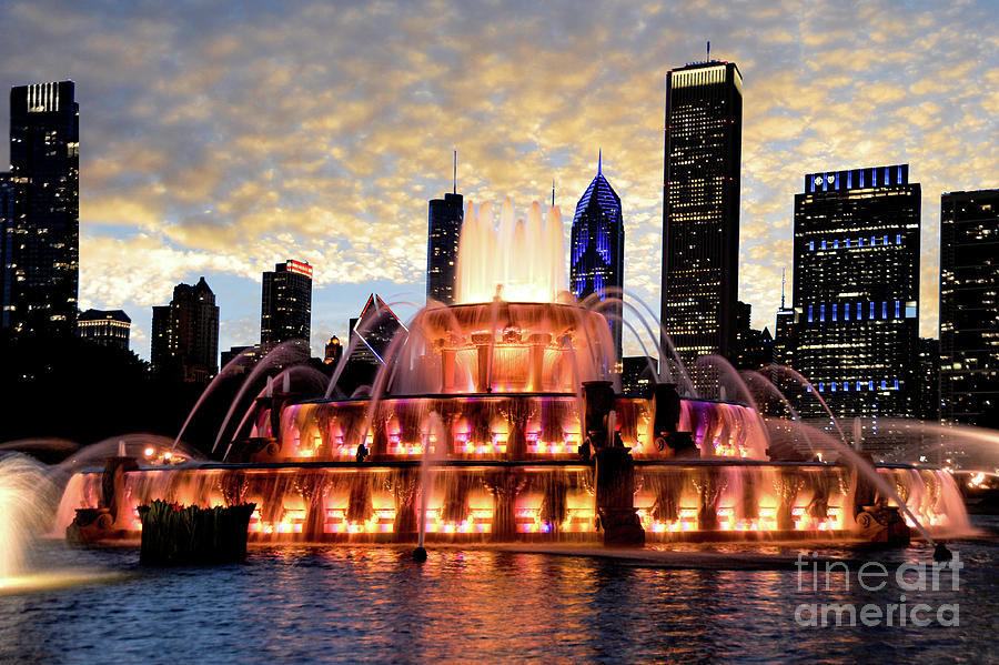 Buckingham fountain with a beautiful sunset background.  Photograph by Gunther Allen