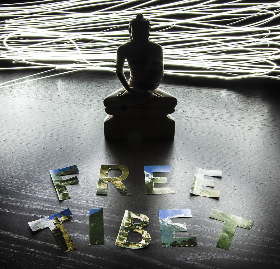 Buddha statue with Free Tibet letters Photograph by EnolaBrain