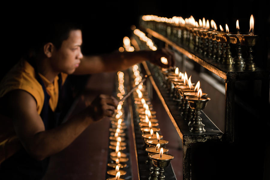 Lamp Photograph - Buddhist Monk Lighting Lamps by Nila Newsom