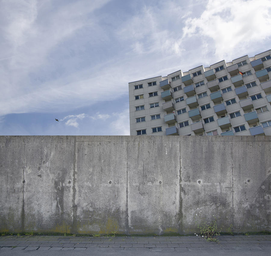 Building behind a concrete wall, composing Photograph by Westend61