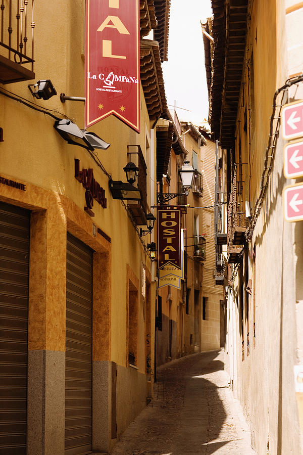 Buildings along an alley, Toledo, Spain Photograph by Glowimages