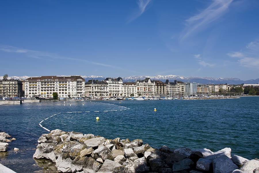 Buildings on the horizon at Lake Geneva, Switzerland Photograph by Mseidelch