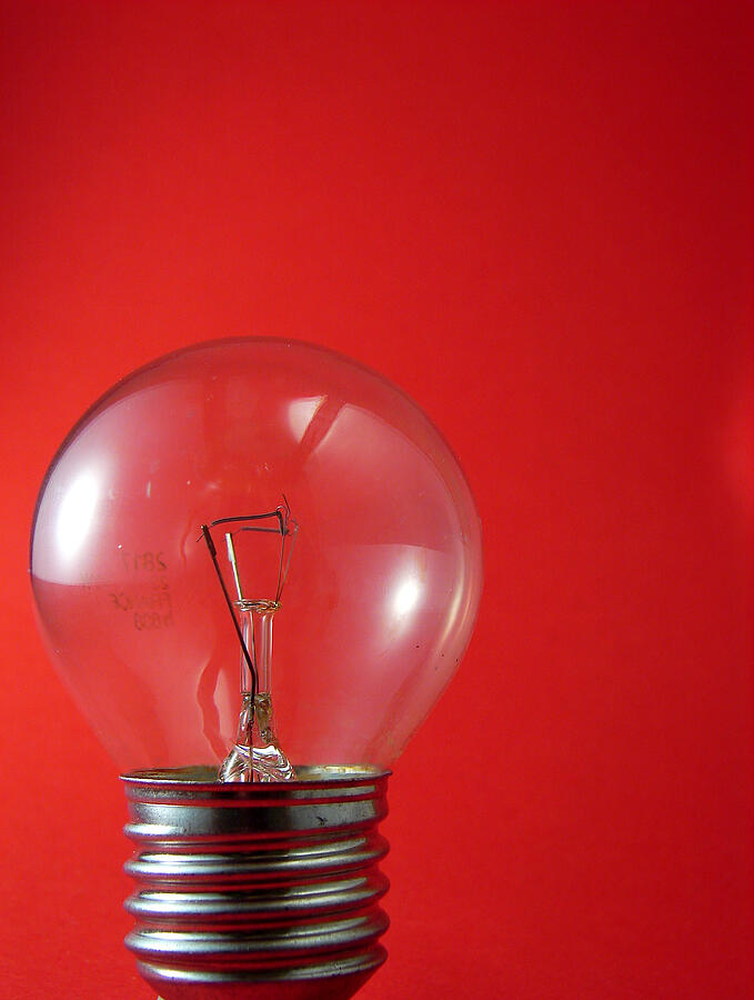 Bulb against red  background  Photograph by Lali Masriera