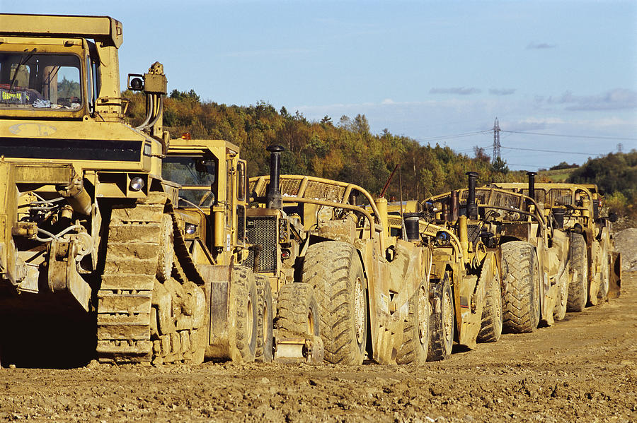 Bulldozers Stationary, in a Line Photograph by Stephen Barnett
