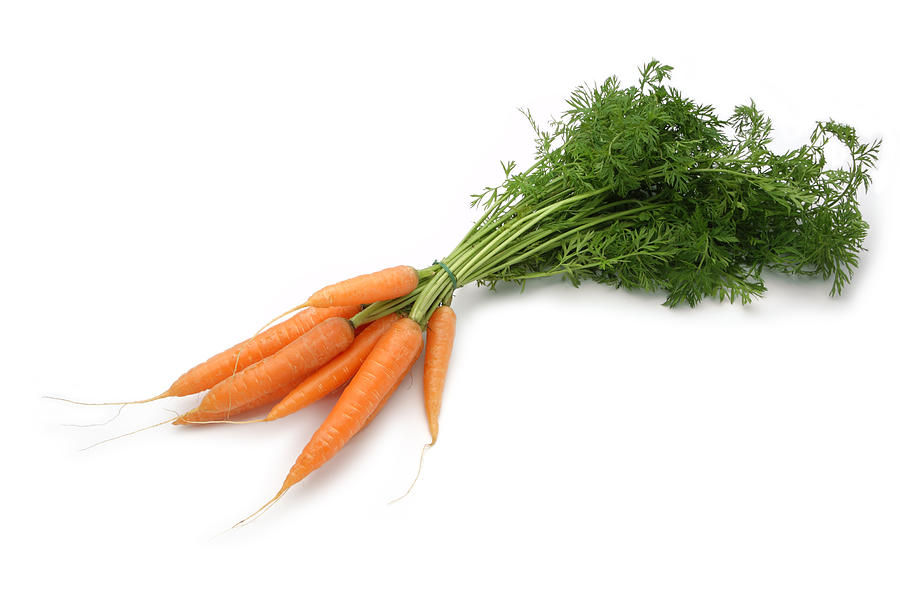 Bundle of small carrots on white background Photograph by Kgfoto
